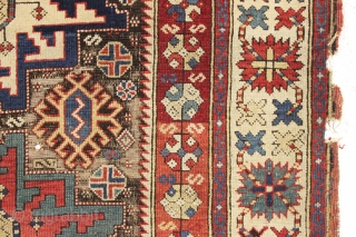 antique caucasian rug, probably kuba, with bold lesghi stars and the complex drawing that indicates good age. As found, mostly good pile elements on a very corroded brown ground. Some scattered damage  ...