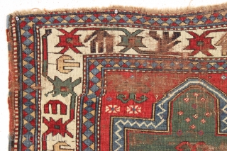 Early kazak prayer rug with true green field. Archaic field elements and bold eye catching ivory border. All good natural colors featuring a beautiful old green, a fine red, multiple blues and  ...