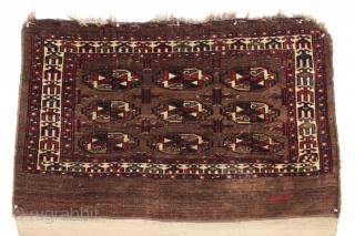 Antique turkoman chuval. Dark and strange but I find it oddly attractive. I like the border. Mostly decent low pile as shown. Unusual pallete but all natural, no dye run. Original back.  ...