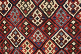 Antique tribal mystery rug. Charming little rug with a kurdish type diamond lattice design, complete with offset knotting in the field area. The overall color palette appears more veramin or luri to  ...
