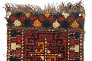 antique liitle pile uzbek or something yastik like object. Coarse weave with long thick pile. Strange palette as shown. Appears to have goat hair warps. Old cloth sleeve sewn on back for  ...