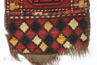 antique liitle pile uzbek or something yastik like object. Coarse weave with long thick pile. Strange palette as shown. Appears to have goat hair warps. Old cloth sleeve sewn on back for  ...
