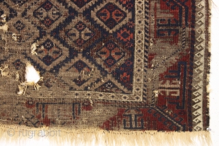 antique baluch rug with an unusual "c gul" design. As found, in very very very rough condition as shown. Heavily oxidized browns. Finely woven with remnant original selvages and kelim ends. Interesting  ...