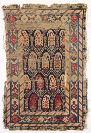 antique rug or what remains of one. Transcendent border. In what I would describe as poor but more or less intact condition. I guess less. As found, thin and dirty with substantial  ...