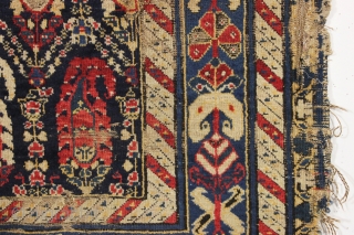 antique rug or what remains of one. Transcendent border. In what I would describe as poor but more or less intact condition. I guess less. As found, thin and dirty with substantial  ...