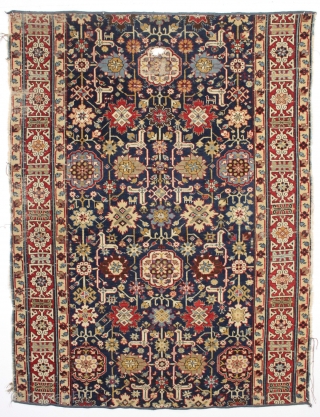 Antique large caucasian carpet fragment. Older afshan or blossum carpet type design with nice red kufic border. All vibrant natural colors. Mostly good even low pile. Small damaged area as shown, scattered  ...