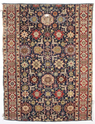 Antique large caucasian carpet fragment. Older afshan or blossum carpet type design with nice red kufic border. All vibrant natural colors. Mostly good even low pile. Small damaged area as shown, scattered  ...