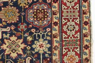 Antique large caucasian carpet fragment. Older afshan or blossum carpet type design with nice red kufic border. All vibrant natural colors. Mostly good even low pile. Small damaged area as shown, scattered  ...