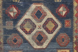 Antique kazak rug. Striking design and colors. "New England condition", in other words, very poor condition with very low pile, heavy wear and as dirty as they come. Who knows what will  ...