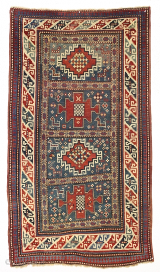 Antique small kazak rug. Charming little karachopf long type variant. All natural colors with lots of nice old greens. Decent overall condition with good edges and ends. Mostly good pile, a bit  ...