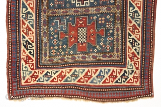 Antique small kazak rug. Charming little karachopf long type variant. All natural colors with lots of nice old greens. Decent overall condition with good edges and ends. Mostly good pile, a bit  ...