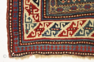 Antique small kazak rug. Charming little karachopf long type variant. All natural colors with lots of nice old greens. Decent overall condition with good edges and ends. Mostly good pile, a bit  ...