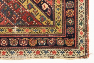 early little caucasian rug with some unusual design elements and splendid color. High quality wool with all natural colors featuring multiple reds, deep greens, fine old purples and beautiful yellow highlights. Never  ...