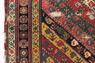 early little caucasian rug with some unusual design elements and splendid color. High quality wool with all natural colors featuring multiple reds, deep greens, fine old purples and beautiful yellow highlights. Never  ...