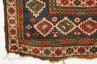 interesting older kazak rug with an unusual design and splendid colors. Eye catching main border. All natural colors featuring beautiful old greens. Appears to have a fair amount of natural dark wool  ...