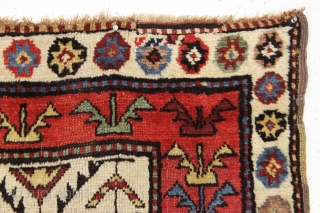 large antique ivory ground tribal persian rug with a great large scale palmette design. Rainbow colored main border. Possibly Luri? Beautiful natural colors including a fine old purple. Overall good condition with  ...