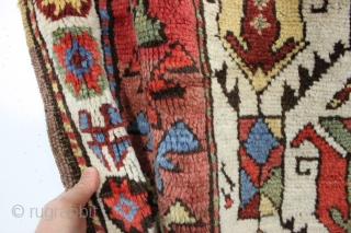 large antique ivory ground tribal persian rug with a great large scale palmette design. Rainbow colored main border. Possibly Luri? Beautiful natural colors including a fine old purple. Overall good condition with  ...