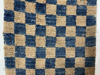 Interesting early Tibetan pile weaving in the classic checkerboard design. Complete little weaving with original selvages. Unclear what this was this long narrow weaving was made for or if this is a  ...