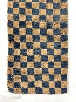 Interesting early Tibetan pile weaving in the classic checkerboard design. Complete little weaving with original selvages. Unclear what this was this long narrow weaving was made for or if this is a  ...