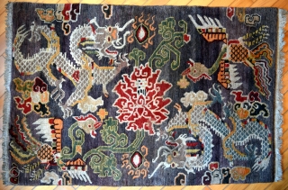 This is an exquisite vintage Tibetan rug which is approximately 50 years old. The rug was hand knotted on a traditional wooden loom using age-old techniques and 100% natural dyes. It was  ...