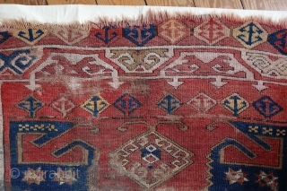 Konya Karapinar Fragment, 170x132 cm. Attached to linen. This damaged and worn 19th c. fragment is remarkable because of the uniqueness of the central emblem, from Turkoman origins.     