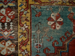 Ladik Prayer rug. Before 1800. 100x200cm, mounted on linen. The great age of this magnificient rug is confirmed, apart from the iconographics, by the colors. The deep stone-red of the 'ocak'( the  ...