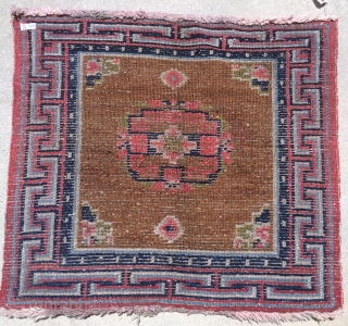 Nice Tibetan Sitting Rug.  No color run and believe colors are all good.  Size 33 x 29 inches.  All wool construction.         