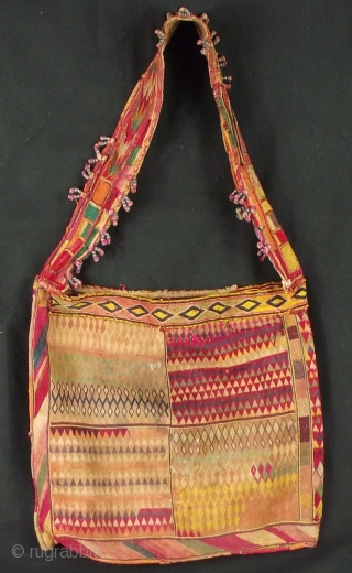 Finely embroidered marriage bag from Madhya Pradesh, with tassels and a couple of period mends.
Signs of wear ,extremely nice example of work from this area of India.
Handle /strap Embroidered with metal bead  ...