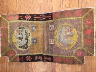 The beauty of this Chinese Saddle rug lies in the richly executed border with endless knot design symbolizing fate and longevity and shou design symbol of  long life flanked by two  ...