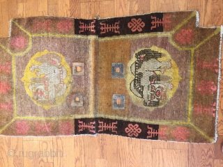 The beauty of this Chinese Saddle rug lies in the richly executed border with endless knot design symbolizing fate and longevity and shou design symbol of  long life flanked by two  ...