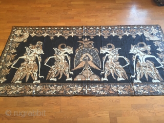 Indonesian cotton Batik wall hanging depicting a scene from wayang kulit(shadow puppet) .                    