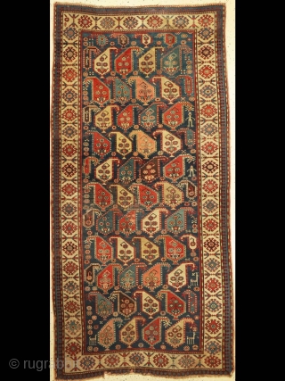 Lovely old gendge rug. The most enjoyable elements are the figures - the two men (yes very clearly men) and their animals. More details here: https://wovensouls.com/collections/antique-persian-rug-carpet/products/1645-antique-gendge-boteh-rug-with-figures       