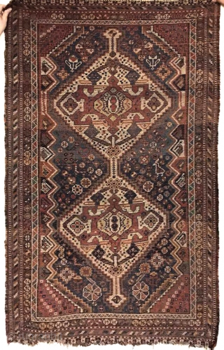 A gorgeous Qashqai with a backing. Worn out but still looks great on the wall. See more here: https://wovensouls.com/collections/antique-persian-rug-carpet/products/1074-antique-qashqai-rug-as-wall-art              