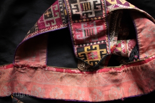 Rare Uzbek Lakai tribe camel headdress.

This camel headdress is formed from three different silk needlepoint embroidered bands, each with different borders, the main lower band with meander borders. Judging rom the motifs  ...