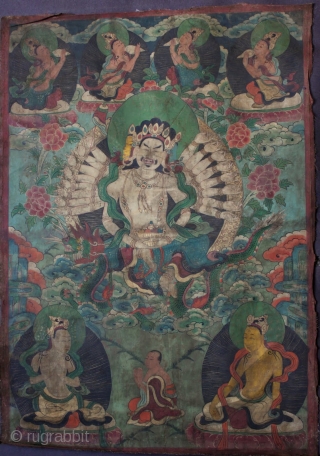 A very unusual Nepalese or perhaps East Tibetan 19th century Buddhist thangka of Maha Cundi with eighteen arms seated on a green dragon and holding a basket of jewels with four aspara  ...