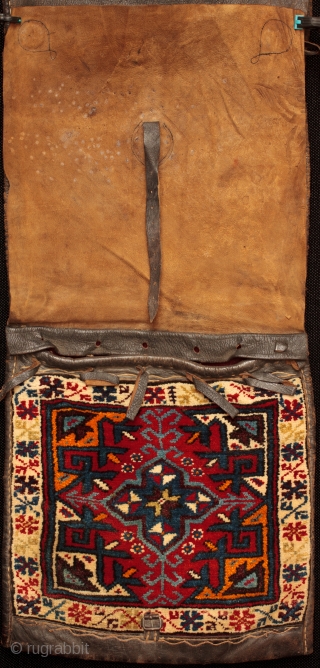 Lift the leather covers to find out what is underneath! An old Anatolian heybe saddle bag from Dosemealti of exceptional craftmanship. Leather covers have protected the bag faces leaving the colours in  ...
