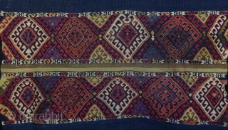 Pair of late 19th century Anatolian Malatya dowry chuvals. 163cm x 100cm and 143cm x 100cm. Finely embroidered silk panels on woven wool kilim foundation with striped skirts, angora tassels in centre  ...