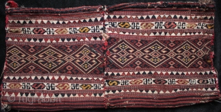 East Anatolian Shavak baby carrier, complete with kilim back.

Finely woven on a narrow hand loom in two joined soumac panels. Circa 1900 in original, unrepaired condition. Size 75x36cm. One of three Shavak  ...