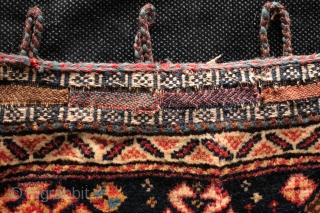 Pair of antique Kashgai/Qashqai khorjin bags with close connections but subtle variations between the two, so almost certainly from the same family. Finely striped full kilim backs, closure loops and lappets. A  ...