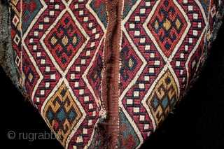 Antique Anatolian chuval from East Anatolia with intense natural dyes.

An unusual survivor, a 19th century East Anatolian chuval with beautiful natural dyes in original condition with old nomadic patch repairs and some  ...