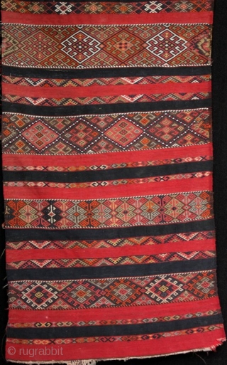 An old Anatolian long kilim runner, tightly woven flat weave with very fine çiçim and soumak embroidery, I estimate from the 1920s. Excellent drawing, good colours and in very good condition. 285x84cm

For  ...