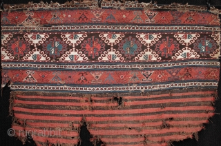 Antique Shahsavan soumac and kilim mafrash panel.

Unusually still with part of its striped kilim base intact, this mid 19th century Shahsavan mafrash is in original condition, finely woven and with good colours.  ...