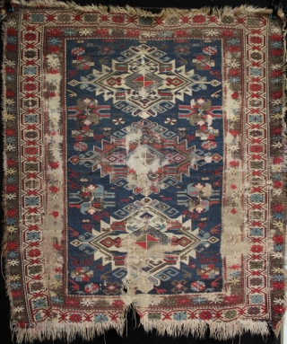 A worn 19th century Shirvan rug with archaic large medallions. Foundation and loss to borders, an interesting example. 140x120cm

For more photos see: http://www.kilim.ie/TRIBAL_RUGS_and_KILIMS/Pages/SMALL_KNOTTED_RUGS.html

Please contact me for more information     