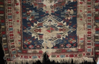 A worn 19th century Shirvan rug with archaic large medallions. Foundation and loss to borders, an interesting example. 140x120cm

For more photos see: http://www.kilim.ie/TRIBAL_RUGS_and_KILIMS/Pages/SMALL_KNOTTED_RUGS.html

Please contact me for more information     