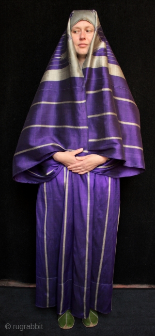 Striking Syrian woman’s silk robe called an Abba or Abbah.

Technically a combined skirt and attached shawl, this type of silk weaving is called 'meydaniyyeh' in local Aleppo/Gaziantep terminology. The robe is made  ...