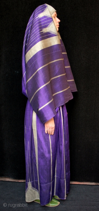 Striking Syrian woman’s silk robe called an Abba or Abbah.

Technically a combined skirt and attached shawl, this type of silk weaving is called 'meydaniyyeh' in local Aleppo/Gaziantep terminology. The robe is made  ...