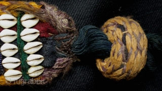 A pair of related but different antique tribal camel neck decorated bands. 

The bands incorporate a variety of materials and construction techniques. They are made using cowrie shells, hand made glass beads  ...