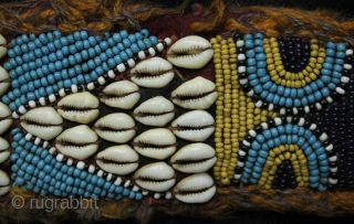 A pair of related but different antique tribal camel neck decorated bands. 

The bands incorporate a variety of materials and construction techniques. They are made using cowrie shells, hand made glass beads  ...