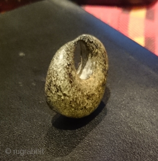 An intriguing ancient bronze crescent moon shaped object found in Kayseri, Anatolia.

Is it an Assyrian or Hittite loom weight as suggested to me or perhaps made as jewellery? An amulet of some  ...
