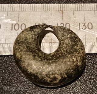 An intriguing ancient bronze crescent moon shaped object found in Kayseri, Anatolia.

Is it an Assyrian or Hittite loom weight as suggested to me or perhaps made as jewellery? An amulet of some  ...